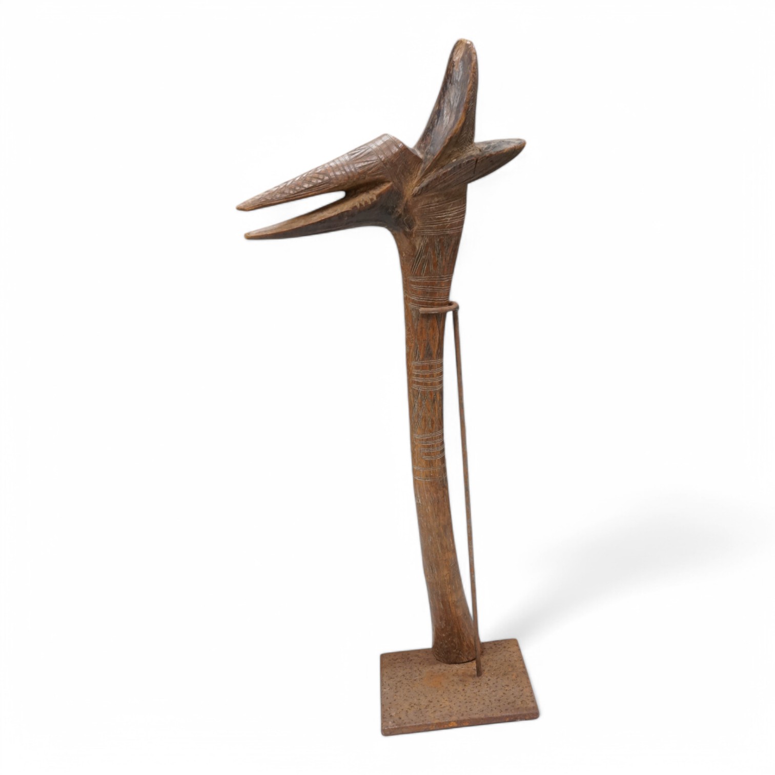 An African tribal club with incised carving, 50cm high. Condition - some chipping